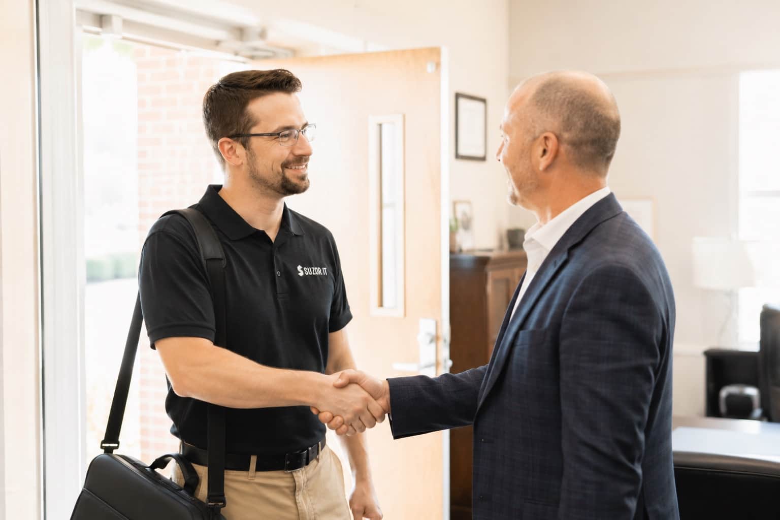 Suzor IT consultant shaking hands with a superintendent